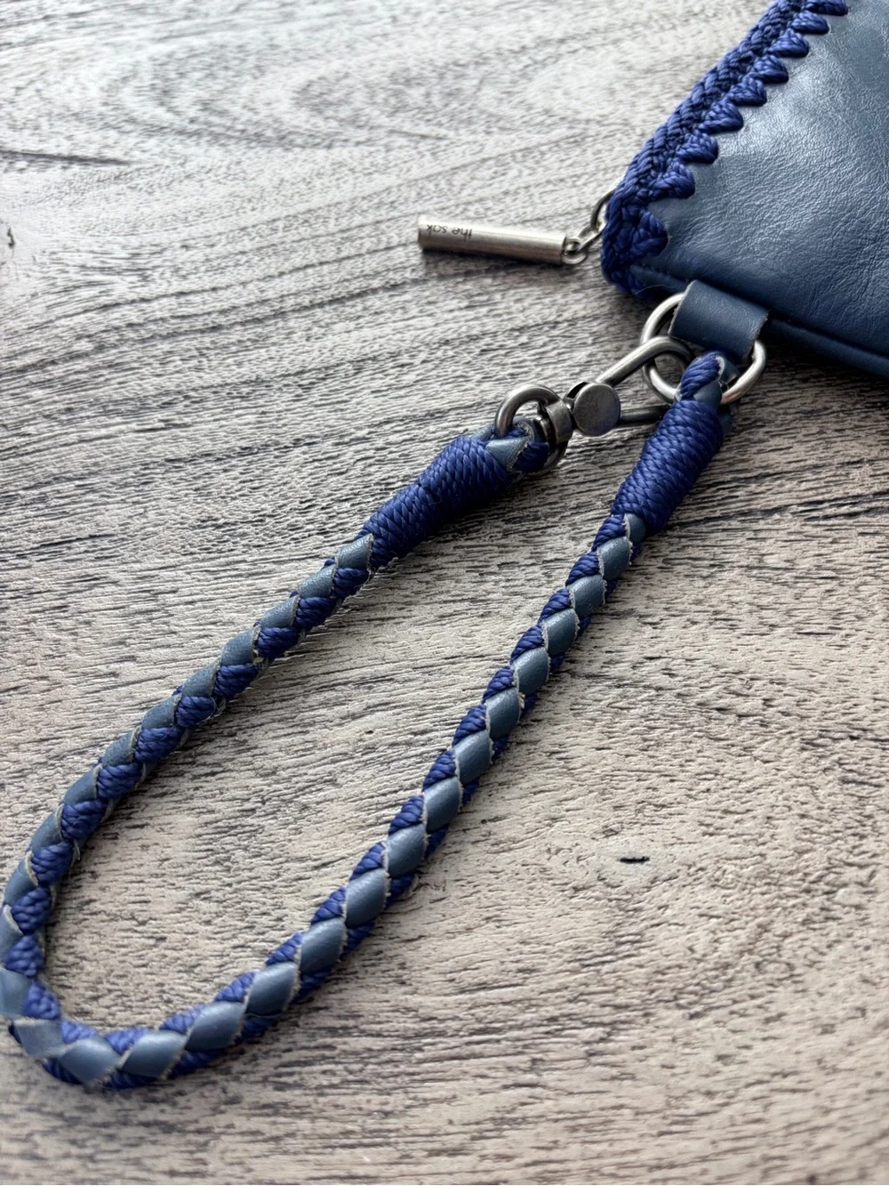 The Sak Vita Blue Leather Boho Wristlet with Crochet Trim EUC